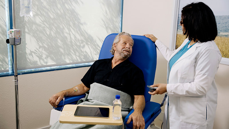 Infusion patient on an infusion chair with a nurse