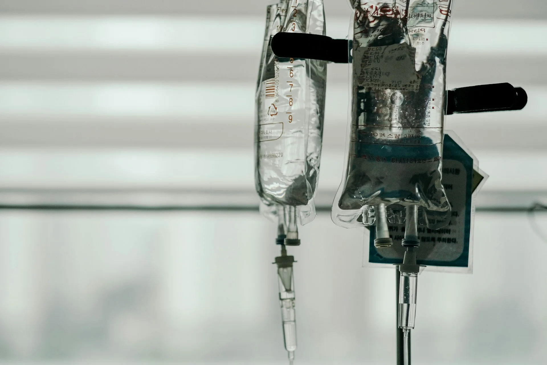 An image of two IV fluid bags hanging up