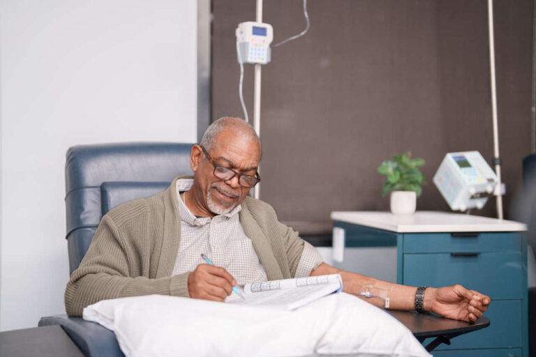 Patient at infusion center receiving IV therapy for inflammation