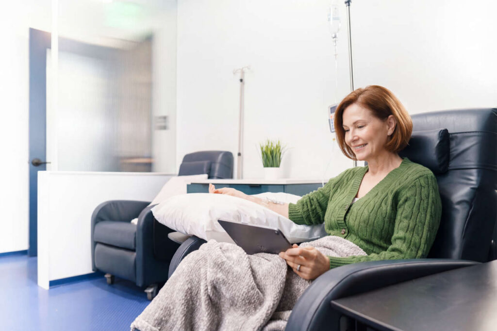 Patient in reclining chair receiving an infusion