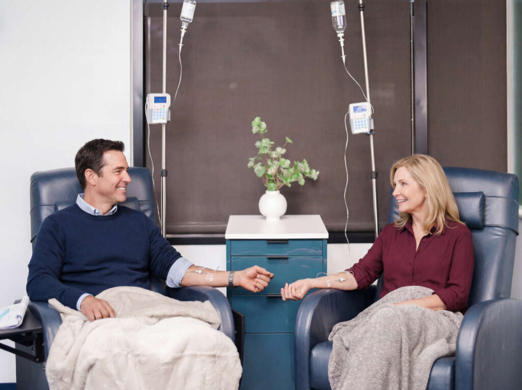 Two smiling patients at the Houston Infusion Center