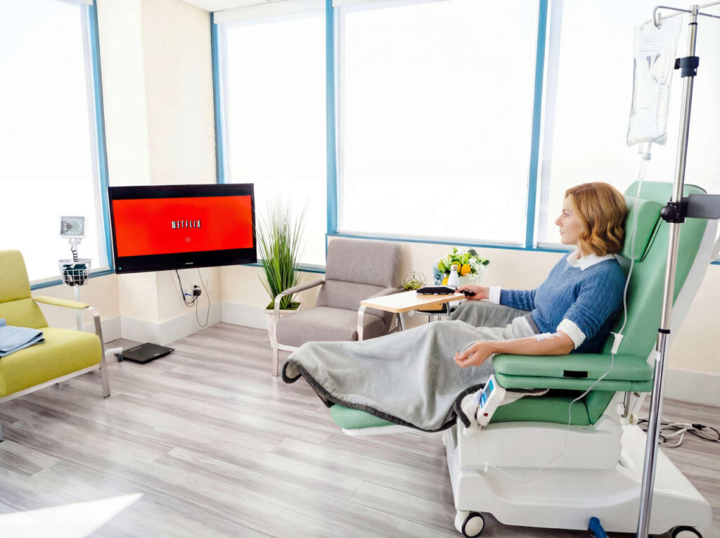 Patient watching Netflix at an infusion suite