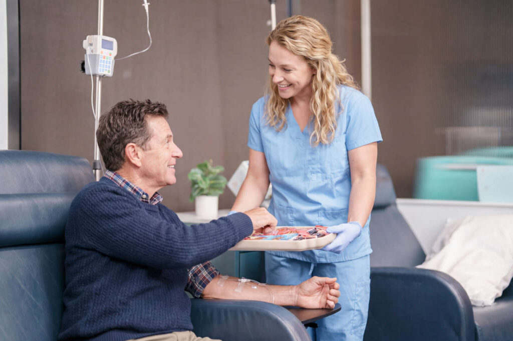 Nurse serving snacks to patient at AmeriPharma Infusion Center in Houston