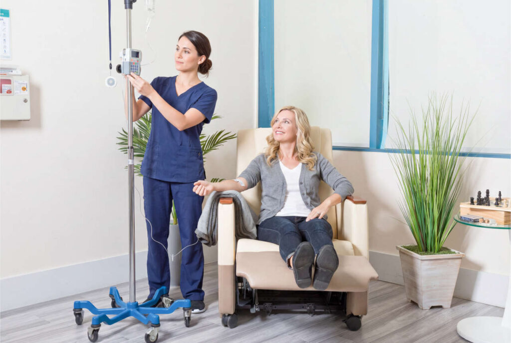 Nurse setting up infusion at an infusion center