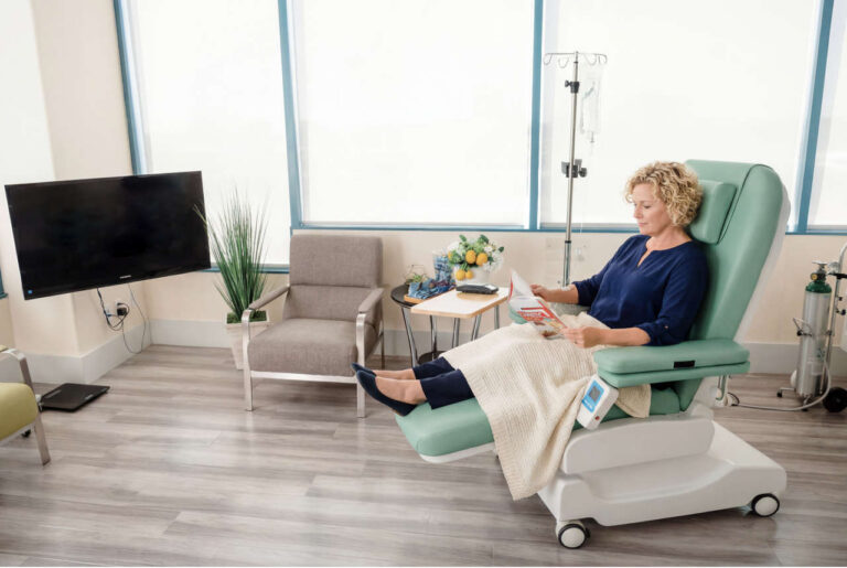 Patient at infusion center receiving IV therapy covered by insurance