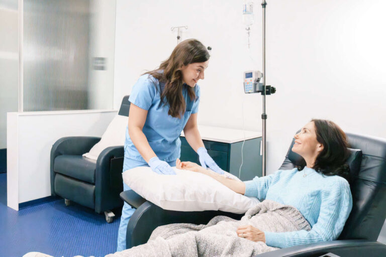 Patient at infusion center receiving IV therapy