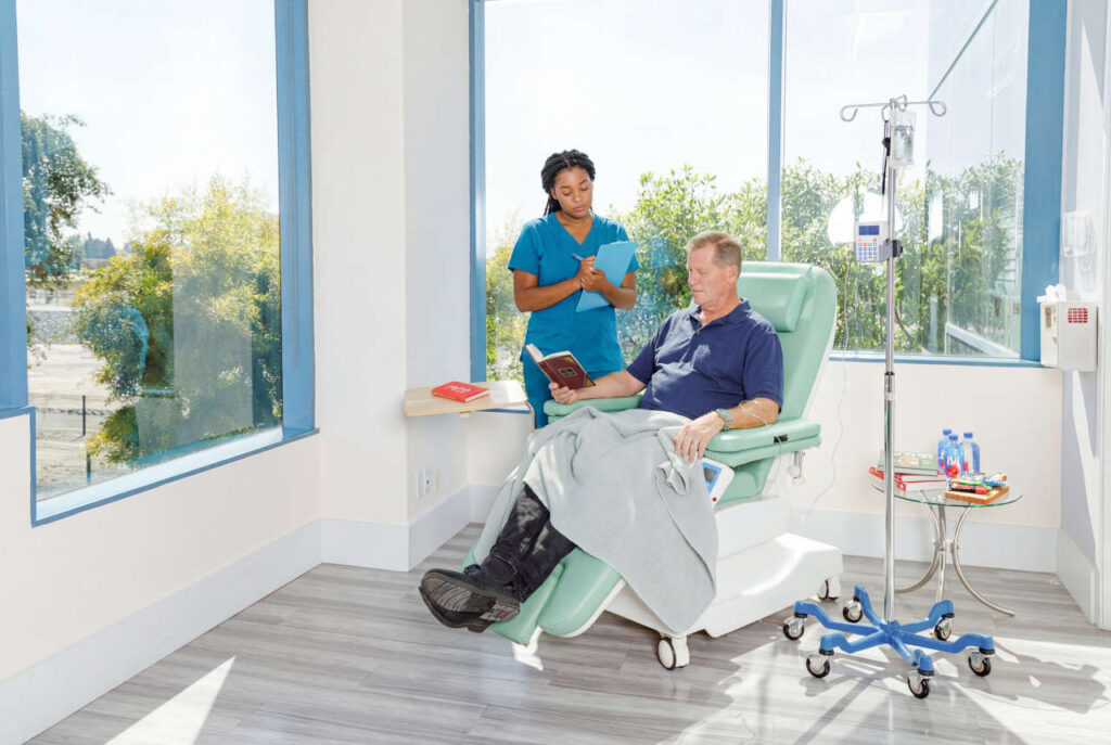 Nurse with patient receiving enzyme replacement therapy at the Kirkland Infusion Center
