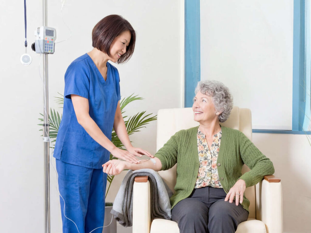 Nurse setting up infusion for patient at Stuart Infusion Center